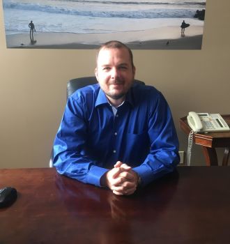 Attorney Mike letsen sitting at his desk.