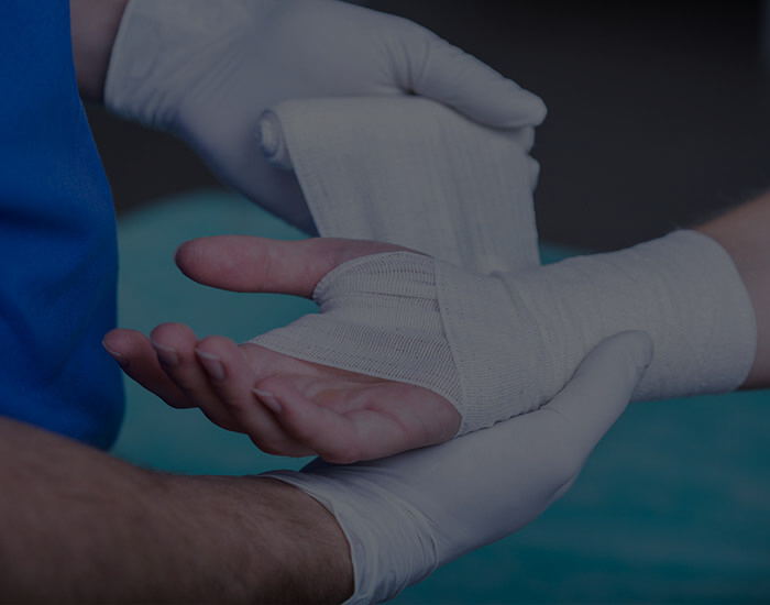 Wrist getting bandaged by doctor