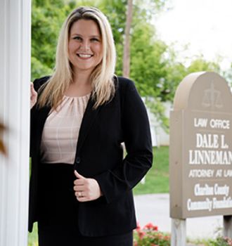 Danielle standing outside the office smiling