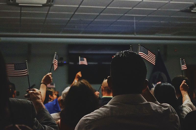 People holding American flags