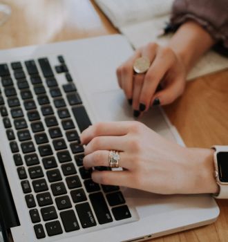 Woman typing at computer