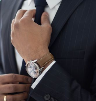 Businessman adjusting his tie
