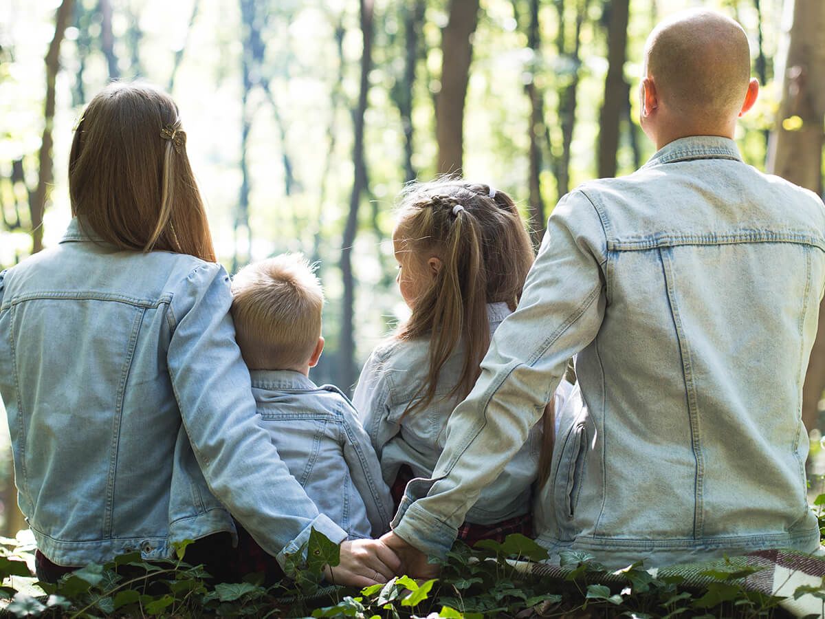 Family sitting together in the wilderness