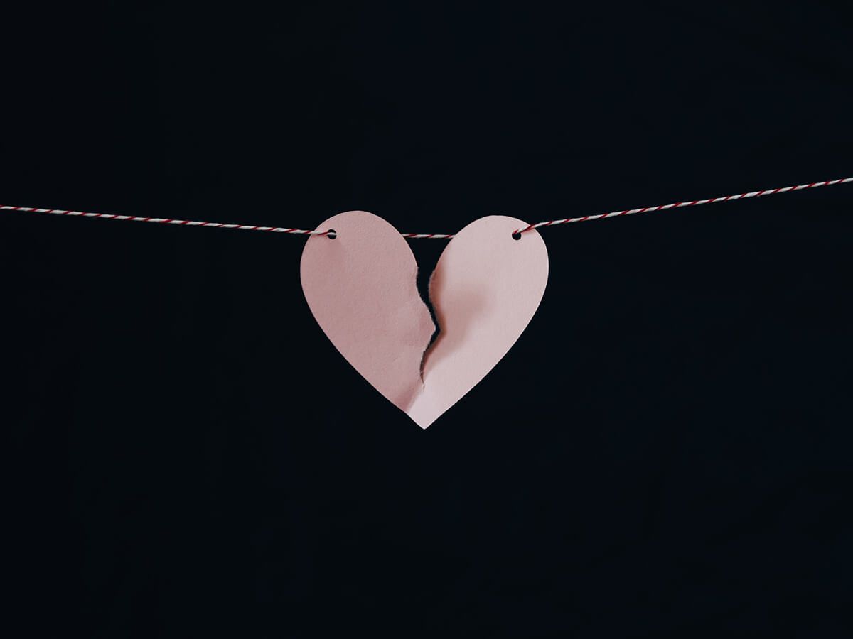 Broken heart cutout hanging on a string