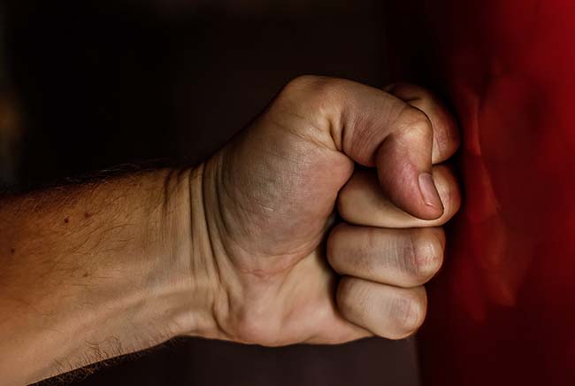 Man punching a wall