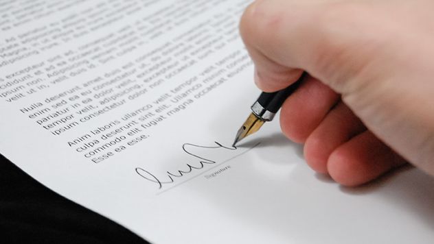 Man signing a contract