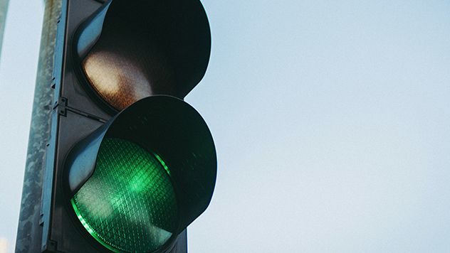 Close up of a stop light with the green light on