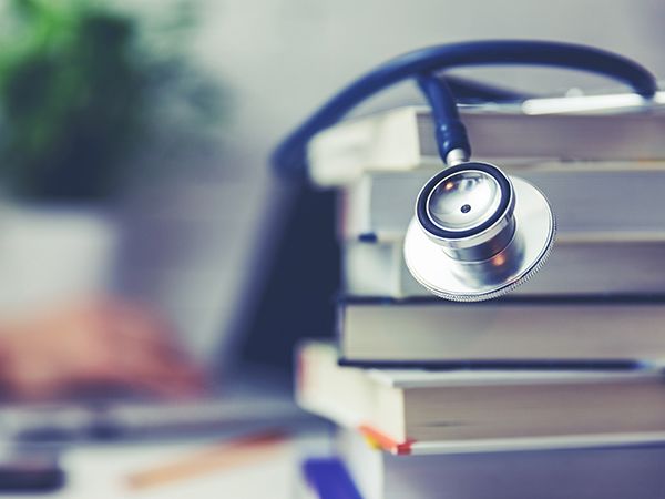 Stack of books with a stethoscope