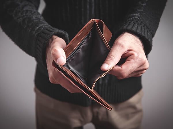 Man holding empty wallet