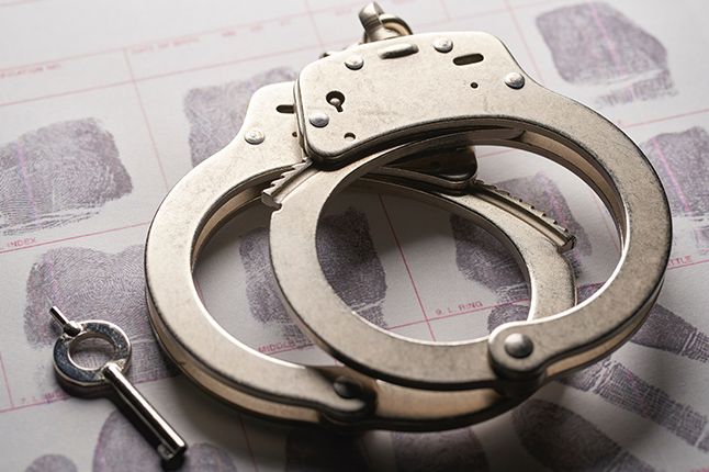 Handcuffs sitting on fingerprints