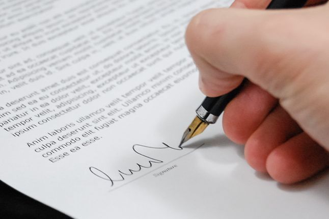 Man signing contract